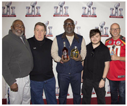 BuccaneersFan Founding Director William Rader, Buccaneer Bobby Howard, Associate Director Daniel Rader and Mark AtlBucs Goodman during 2017 Super Bowl party