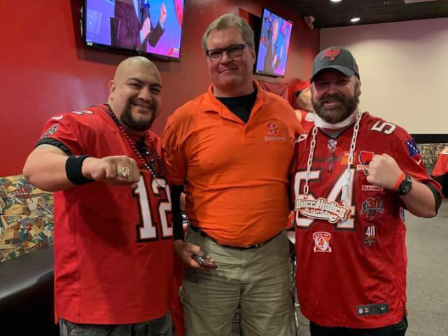 Art Oropeza & Steven Anderson the Captain of California Buccaholics with former Buccaneers OT Kelly Thomas.