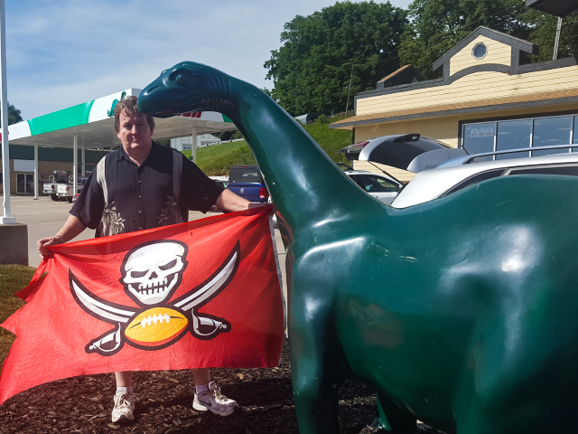 BuccaneersFan.com With any road trip fuel stops are required and who can resist a smiling Dino.